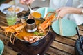 Woman having Thai Tom Yum soup with seafood Royalty Free Stock Photo