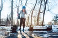 Woman having to step into a puddle of water and thawing snow