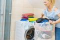 Woman holding laundry basket full of clothes Royalty Free Stock Photo