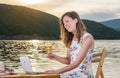 Woman having a video call by the lake Royalty Free Stock Photo