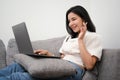 Woman having a video calling via laptop computer in living room Royalty Free Stock Photo