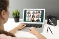 Woman having video chat with colleagues at table in office. Team work Royalty Free Stock Photo