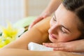 Woman having wellness back massage in spa Royalty Free Stock Photo