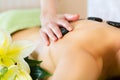 Woman having wellness hot stone massage Royalty Free Stock Photo