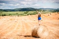 Woman on the hayfield Royalty Free Stock Photo