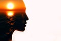 Woman head silhouette with sun inside with copy space. Multiple exposure image. Royalty Free Stock Photo