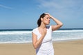 Woman with a headache on the beach Royalty Free Stock Photo