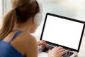 Woman in headphones looking at mock up blank screen.