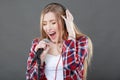 Woman with headphones and microphone singing Royalty Free Stock Photo