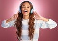 Woman, headphones and music in studio portrait, excited or listen to relax by gradient background. Happy student girl Royalty Free Stock Photo