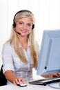 Woman with a headset and computer Hotline