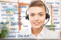 Woman in headset over words in foreign languages Royalty Free Stock Photo