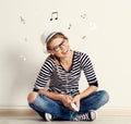 Woman with headset at wall