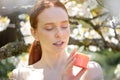 woman with healthy smooth clean skin holding cream jar, use organic cosmetics Royalty Free Stock Photo