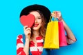 Woman with heart shape toy and shopping bags Royalty Free Stock Photo