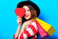 Woman with heart shape toy and shopping bags Royalty Free Stock Photo