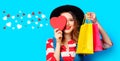 Woman with heart shape toy and shopping bags Royalty Free Stock Photo