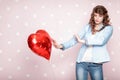 Woman with heart shaped air balloons