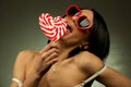 Woman with heart shaped lollipop Royalty Free Stock Photo
