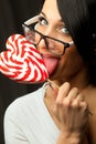 Woman with heart shaped lollipop Royalty Free Stock Photo