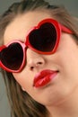 Woman with heart shaped sunglasses Royalty Free Stock Photo