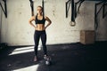 Woman before a heavy kettlebell workout in a gym