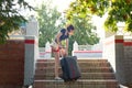 A woman with a heavy suitcase hardly climbs the stairs Royalty Free Stock Photo