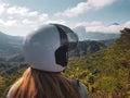 Woman in helmet admire beautiful mountain view in Bali Royalty Free Stock Photo