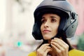 Woman, helmet and safety in city for travel, adventure and road trip in urban street. Girl, protection and journey in Royalty Free Stock Photo