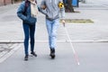 Woman Helping Blind Man While Crossing Road Royalty Free Stock Photo