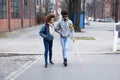 Woman Helping Blind Man While Crossing Road Royalty Free Stock Photo