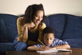 Woman Helping Son with Homework Royalty Free Stock Photo