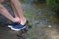 Woman helps a child shoe sneakers