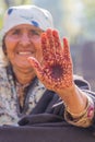 A woman with a henna decorated hand in a village in Jammu and Kashmir