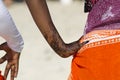 Woman with henna painting and kanga fabric around her waist