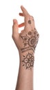 Woman with henna tattoo on hand against white background, closeup. Traditional mehndi