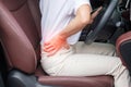 Woman with her back sprain while driving car long time, back body ache due to Piriformis Syndrome, Low Back Pain and Spinal Royalty Free Stock Photo