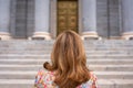 Woman with her back turned in front of the stairs of the main facade of the Congress of Deputies Madrid, Spain Royalty Free Stock Photo