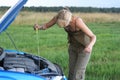 Woman with her broken car.