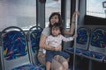 Woman with her child in bus cabin Royalty Free Stock Photo