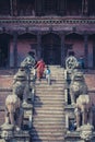 Woman and her child coming down the stairs of the Nyatapola temp Royalty Free Stock Photo