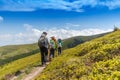 Hiking woman with her children in Romanian mountains Royalty Free Stock Photo