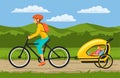 Woman and her children traveling cycling together. Mother tows bike trolley with happy kids Royalty Free Stock Photo