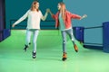 Woman and daughter having fun at roller skating rink Royalty Free Stock Photo