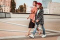 Woman and her daughter walking in the city center