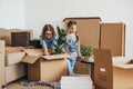 Woman and her daughters moving in new home Royalty Free Stock Photo