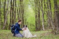 woman with her dog in green forest Royalty Free Stock Photo