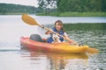 Woman and her dog on a kayak Royalty Free Stock Photo