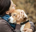 Woman with her dog tender hugs