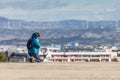 Woman with her dog with a view of the city